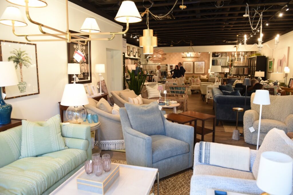 Luxury home decor and furniture display featuring high-end sofas, lamps, and wall art at Antiquarian Shop's Aspinwall location.