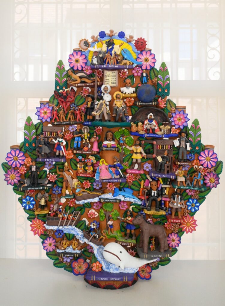 A highly detailed Mexican "Tree of Life" (Arbol de la Vida) pottery sculpture featuring colorful figurines of literary figures and biblical scenes.