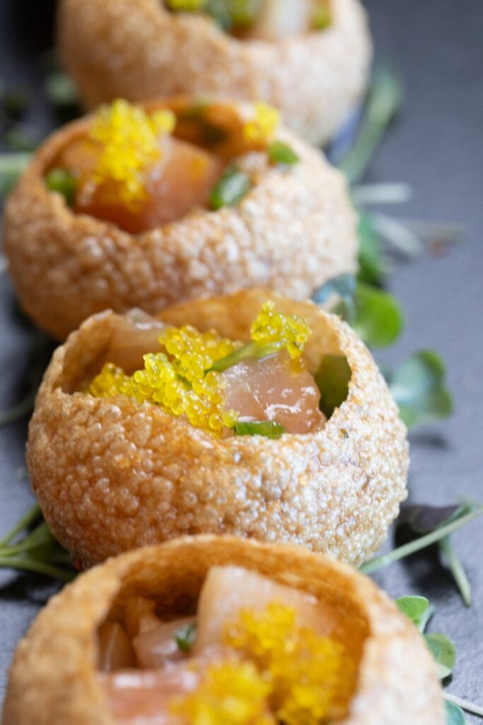 Gourmet yellowtail jalapeño appetizers topped with yellow tobiko at Otaru sushi restaurant on Mount Washington.