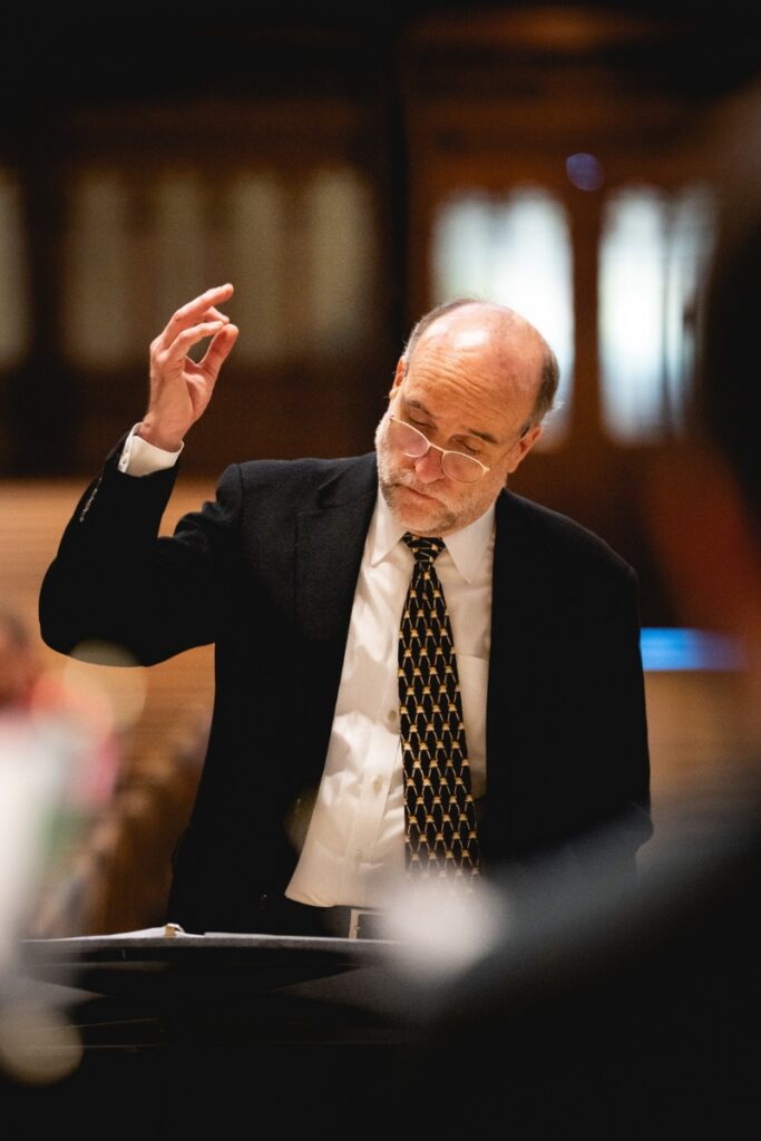 Artistic Director Mark A. Anderson conducting the Pittsburgh Camerata vocal ensemble during a choral performance.