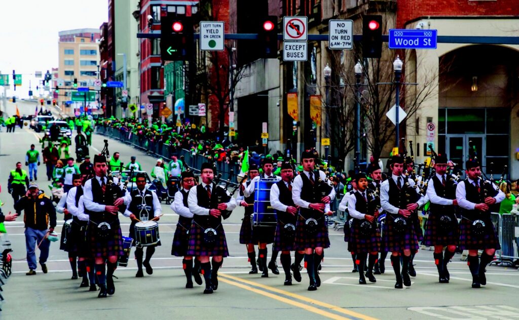 The Carnegie Mellon University pipe band marching and performing at the St. Patrick’s Day parade in downtown Pittsburgh.