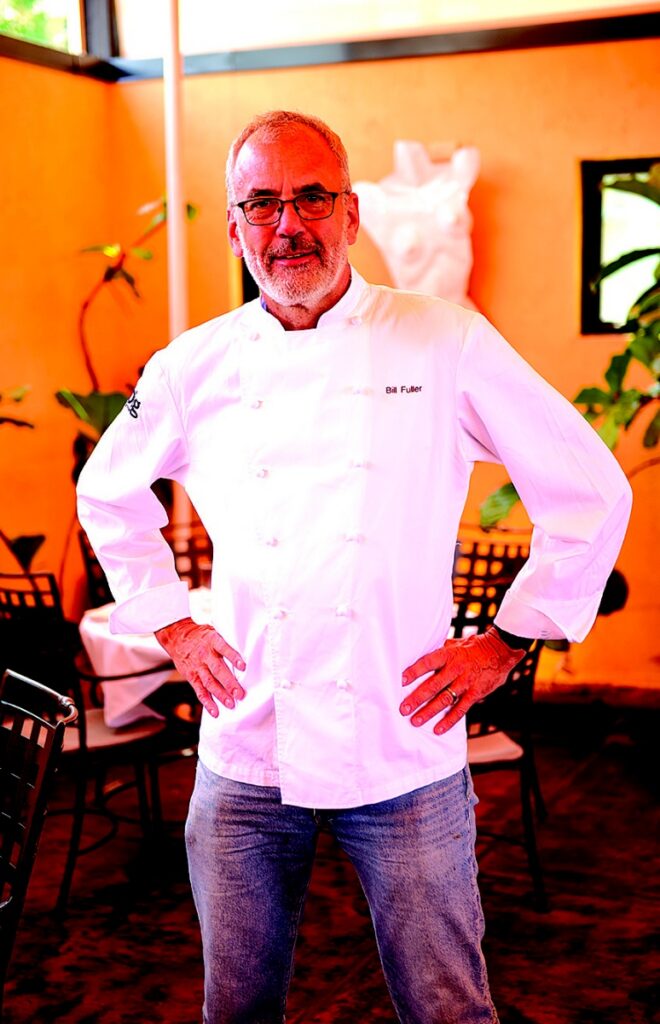 Executive Chef Bill Fuller of Big Burrito group standing in the Mediterranean-inspired dining room of Casbah in Shadyside.