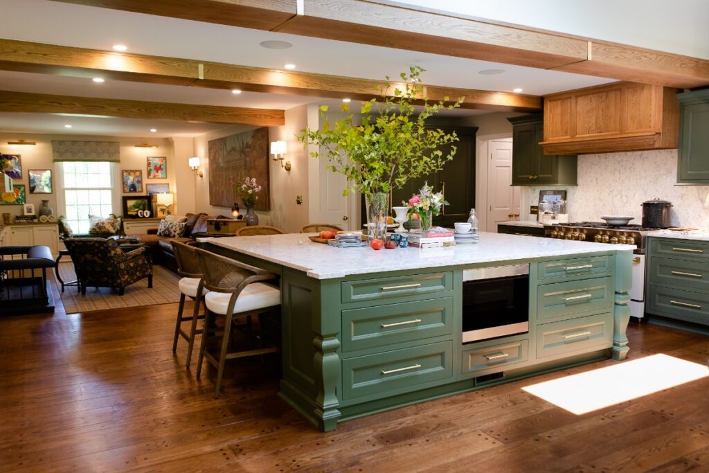 Large open-concept kitchen remodel in Fox Chapel with a massive olive green island and quartz countertops.