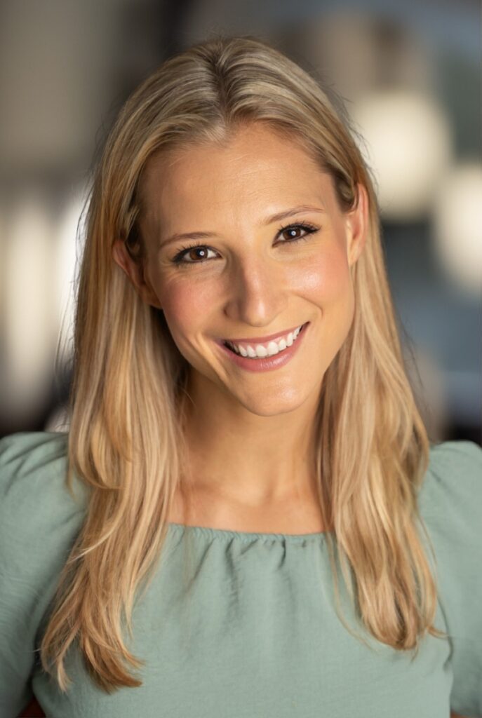 Headshot of Pittsburgh actor and Bricolage teaching artist Rachel Pfennigwerth smiling.