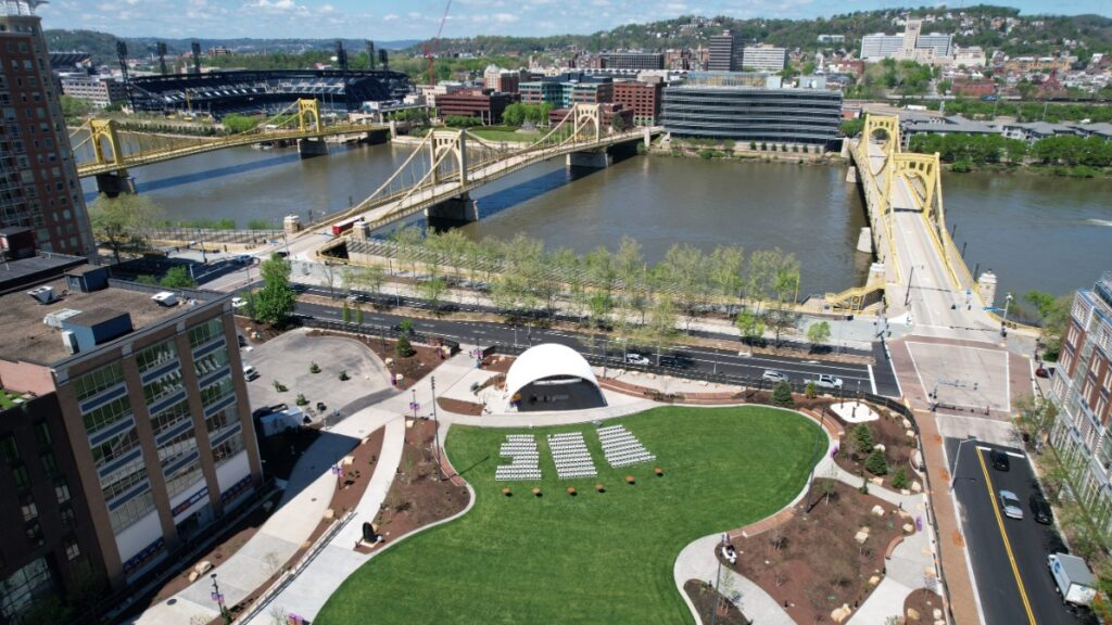 High-angle aerial view of Arts Landing park along the Allegheny River in Downtown Pittsburgh.