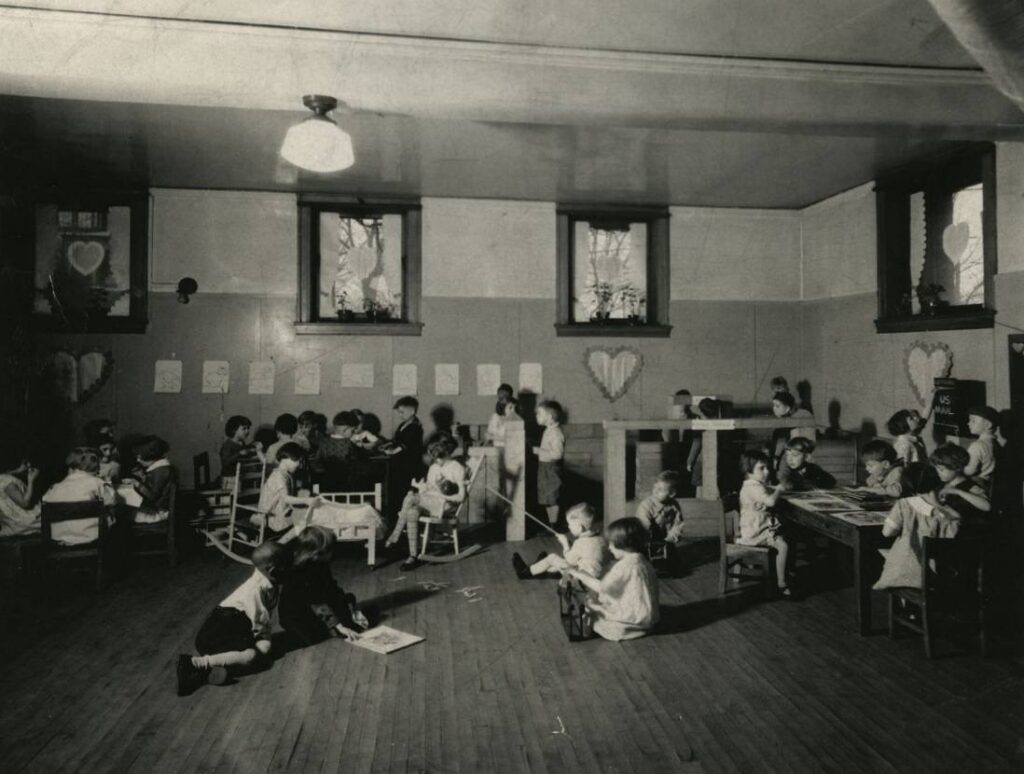 Children playing in an old library room.