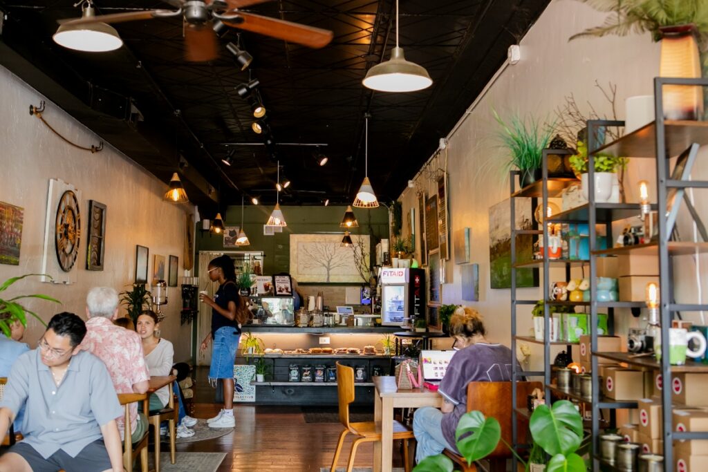 Cozy interior and seating area with customers at Moonbeam Cafe in Oakmont