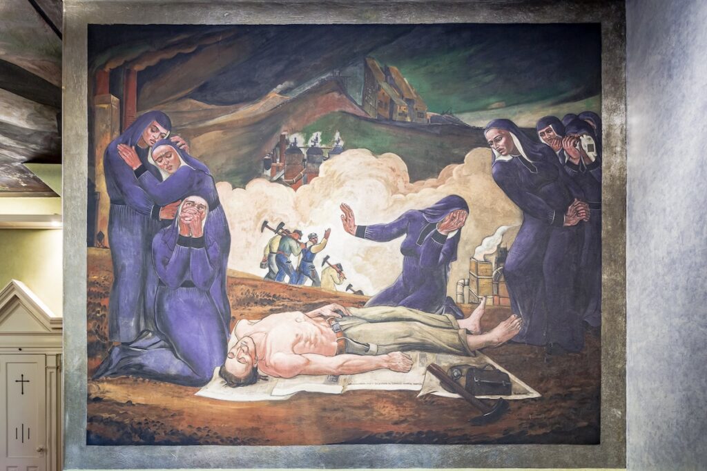 Five nuns in purple gowns in a mural standing around a dead man with no shirt.
